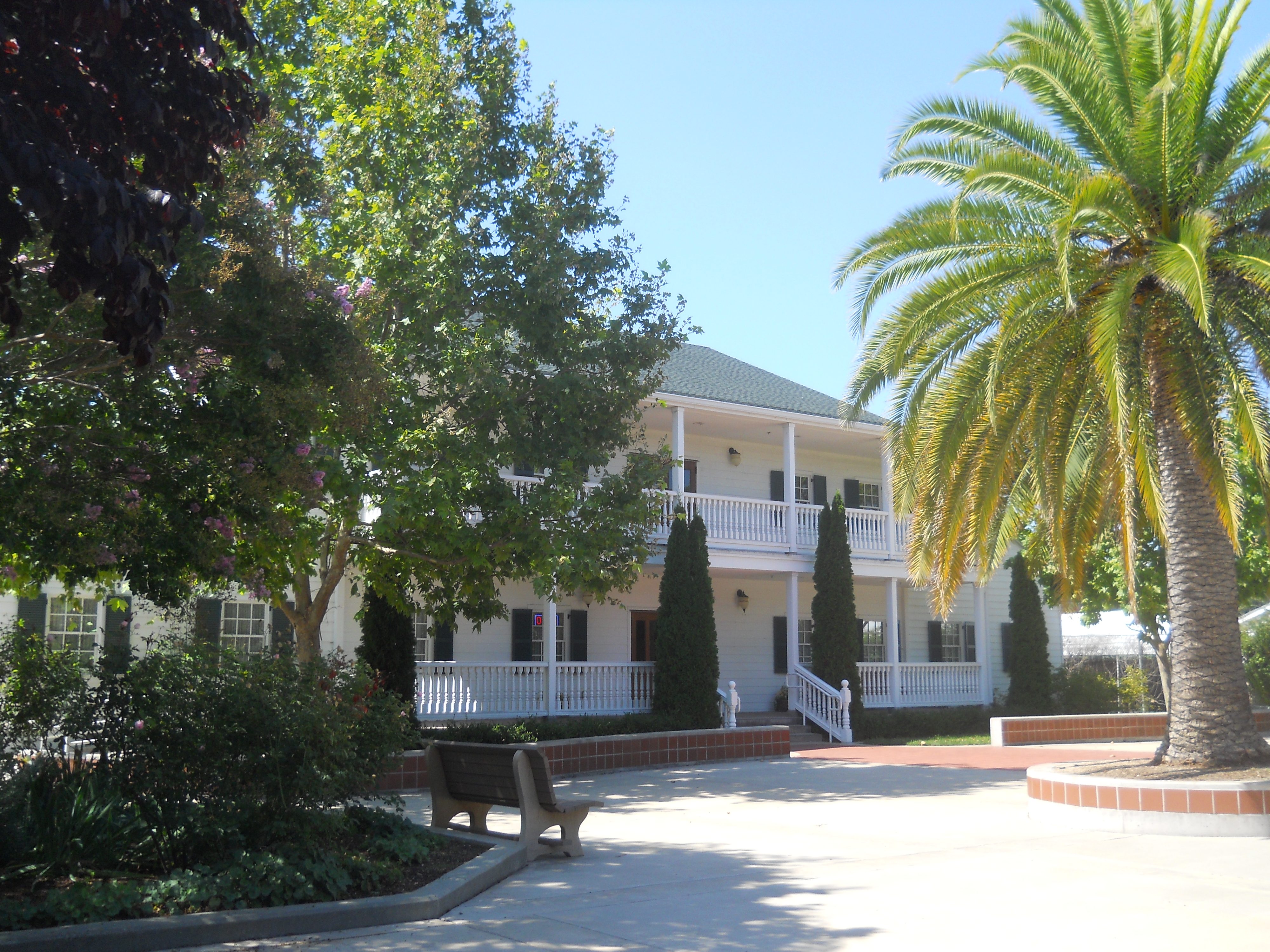 Sunnyvale Heritage Park Museum - a beautiful two-story white colonial-style replica of the Martin Murphy Jr. home with wraparound porches and lush landscaping